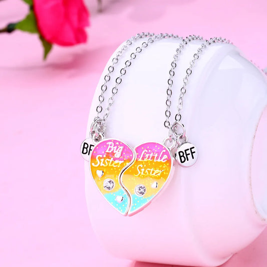 Lot de 2 Colliers ou Bracelets Coeur - Soeurs - Famille Petite Soeur Grande Soeur - Couleur Arc en Ciel - Pendentif Coeur Aimanté